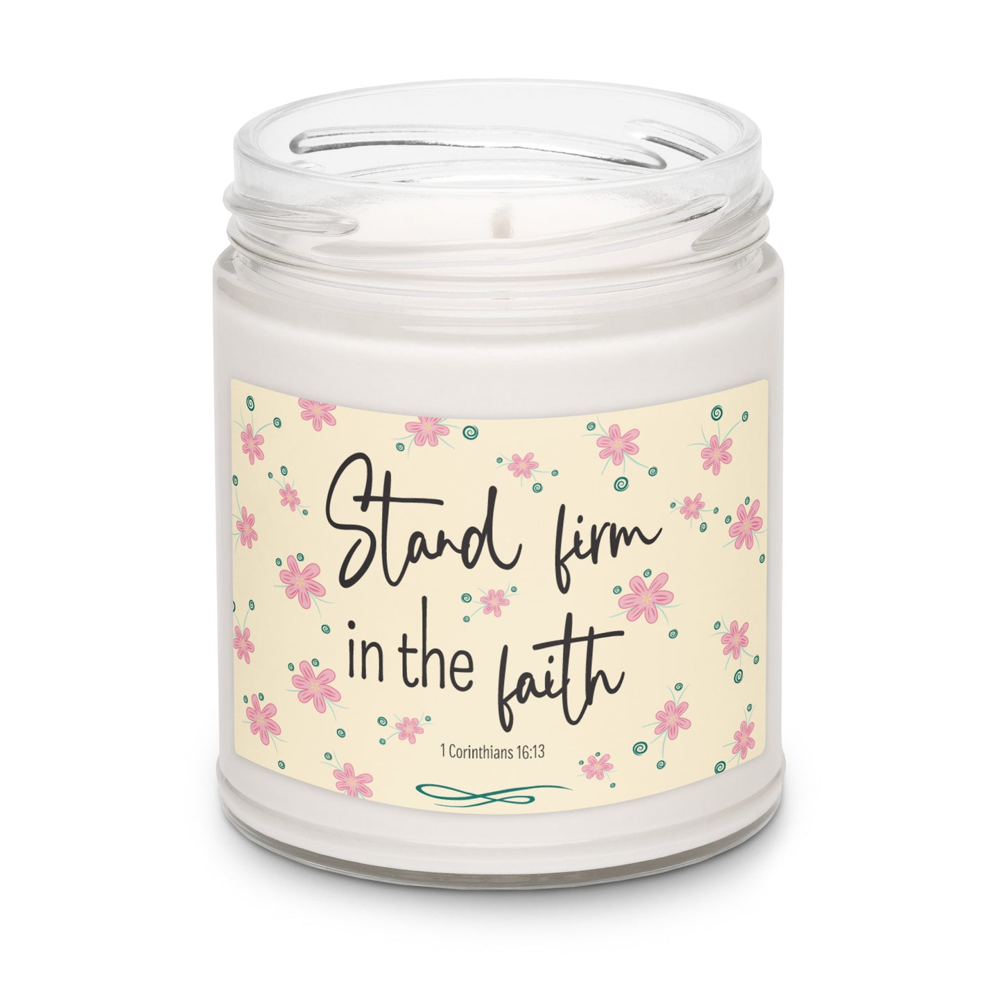 White apple harvest scented soy candle in a clear glass jar with a cream label and pink flowers that says "Stand firm in the faith, 1 Corinthians 16:13.