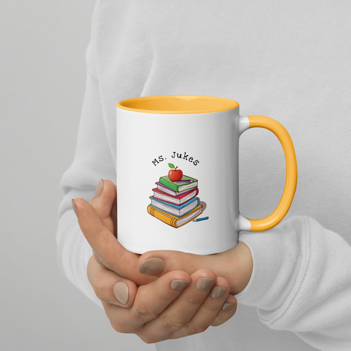 Personalized with Teacher name that says Turning Lessons Into Adventure printed on both sides on white Ceramic Mug with yellow color handle and inside of mug.