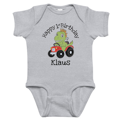 Personalized with childs name Happy Birthday Dinosaur on a Tractor Infant gray bodysuit.