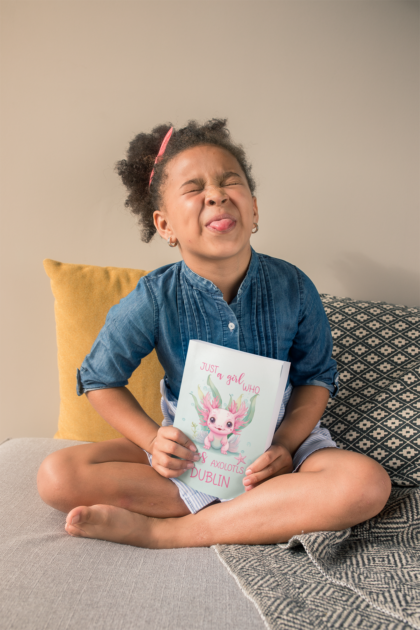 Softcover personalized with name axolotyl notebook held by sassy little girl.