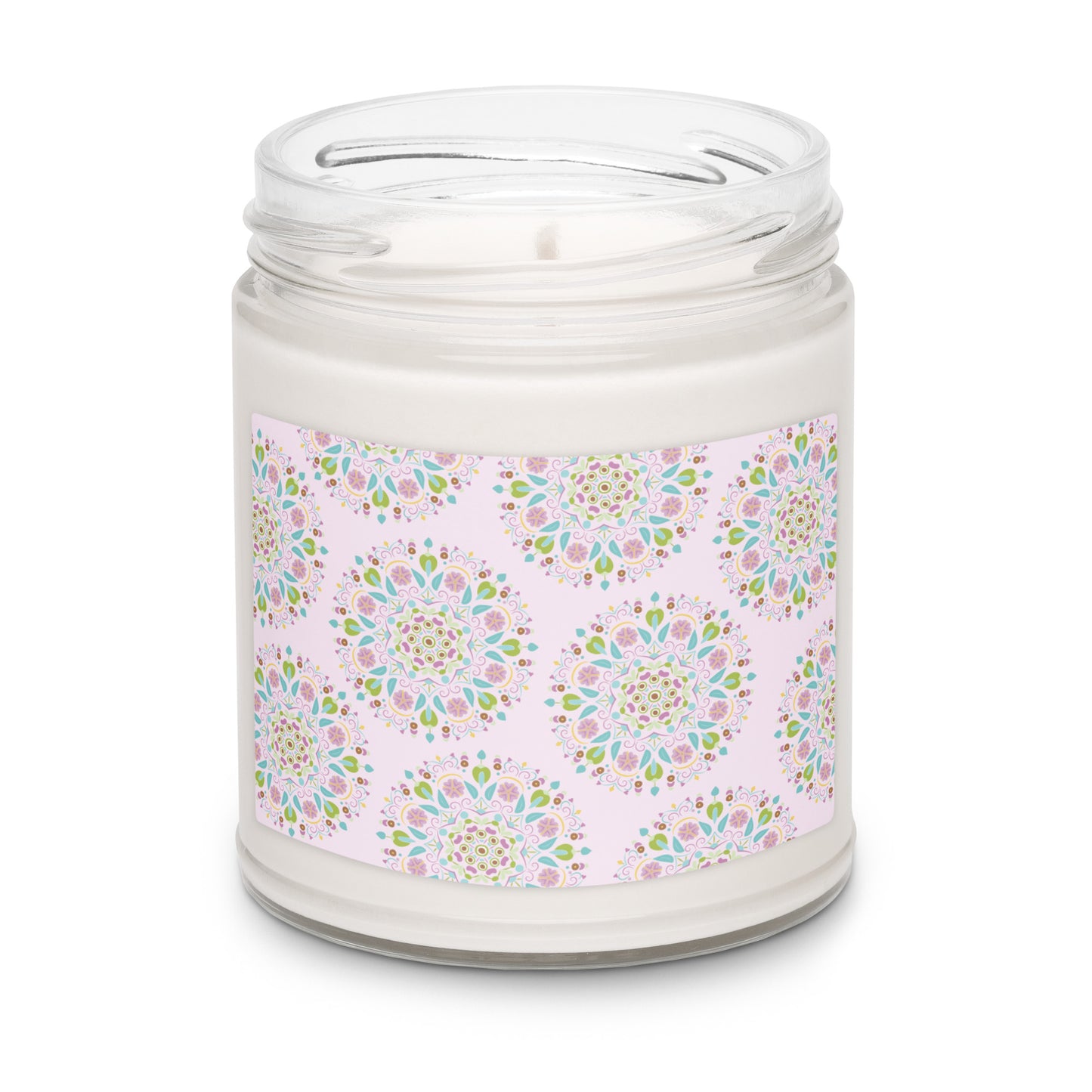 Apple harvest scented white soy candle in a clear glass jar with a label that has a light pink background and scattered with Scandinavian inspired mandalas.