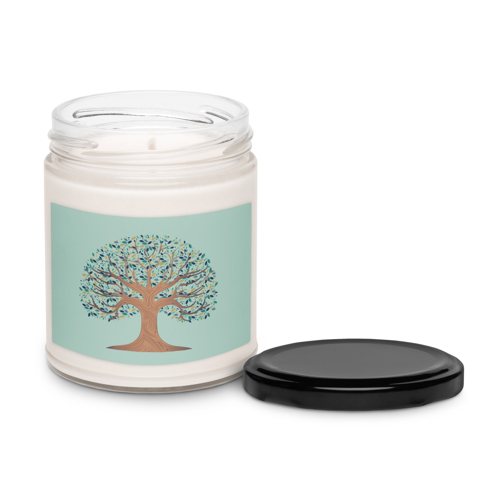 White candle in a clear jar with the Tree of Life with multi colored leaves on a light green background.