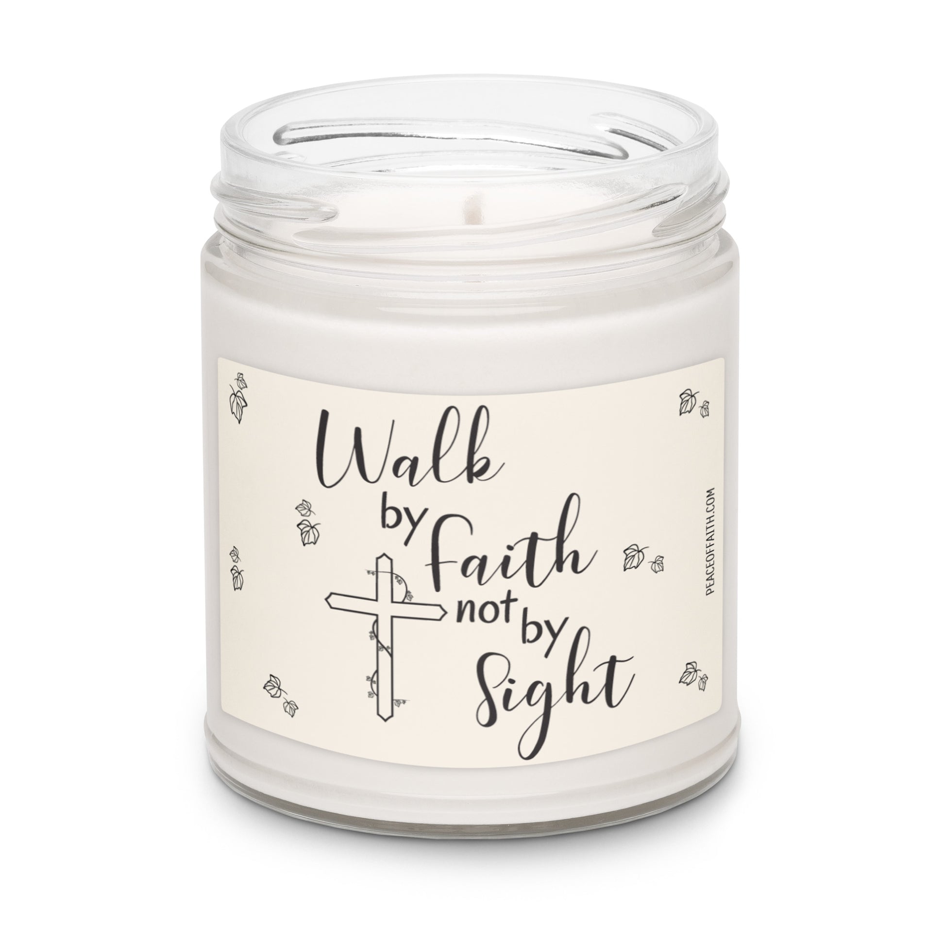Clean cotton scented white soy candle with a label that says 'Walk by Faith not by Sight' with a Christian cross and Ivy leaves. 