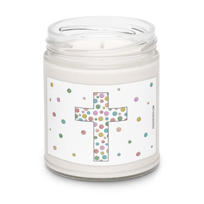 Clean cotton scented white soy candle with a label that has a multi colored polka dotted Christian cross with polka dots around. 
