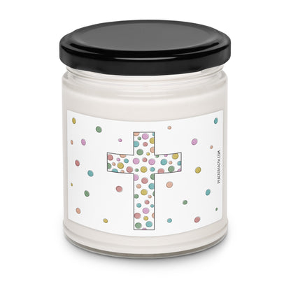 Clean cotton scented white soy candle with a label that has a multi colored polka dotted Christian cross with polka dots around. 