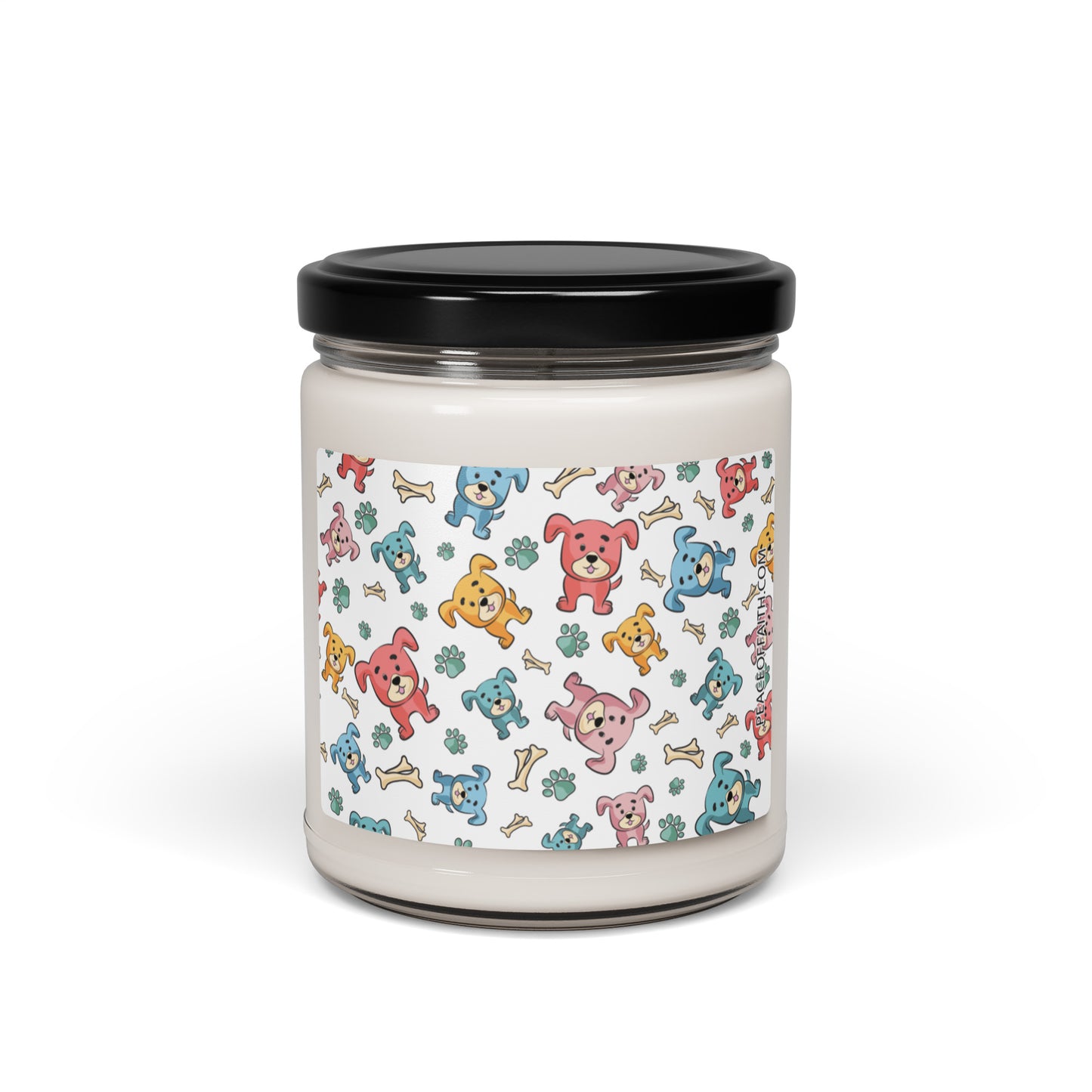 Clean cotton scented soy candle in a clear glass jar with multi-colored puppies with bones and paws tossed around on the front label.