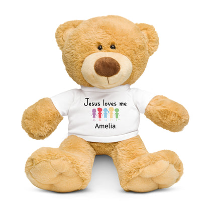 Brown teddy bear with white t-shirt that says Jesus Love Me with colorful cartoon kids holding hands with child's name below.