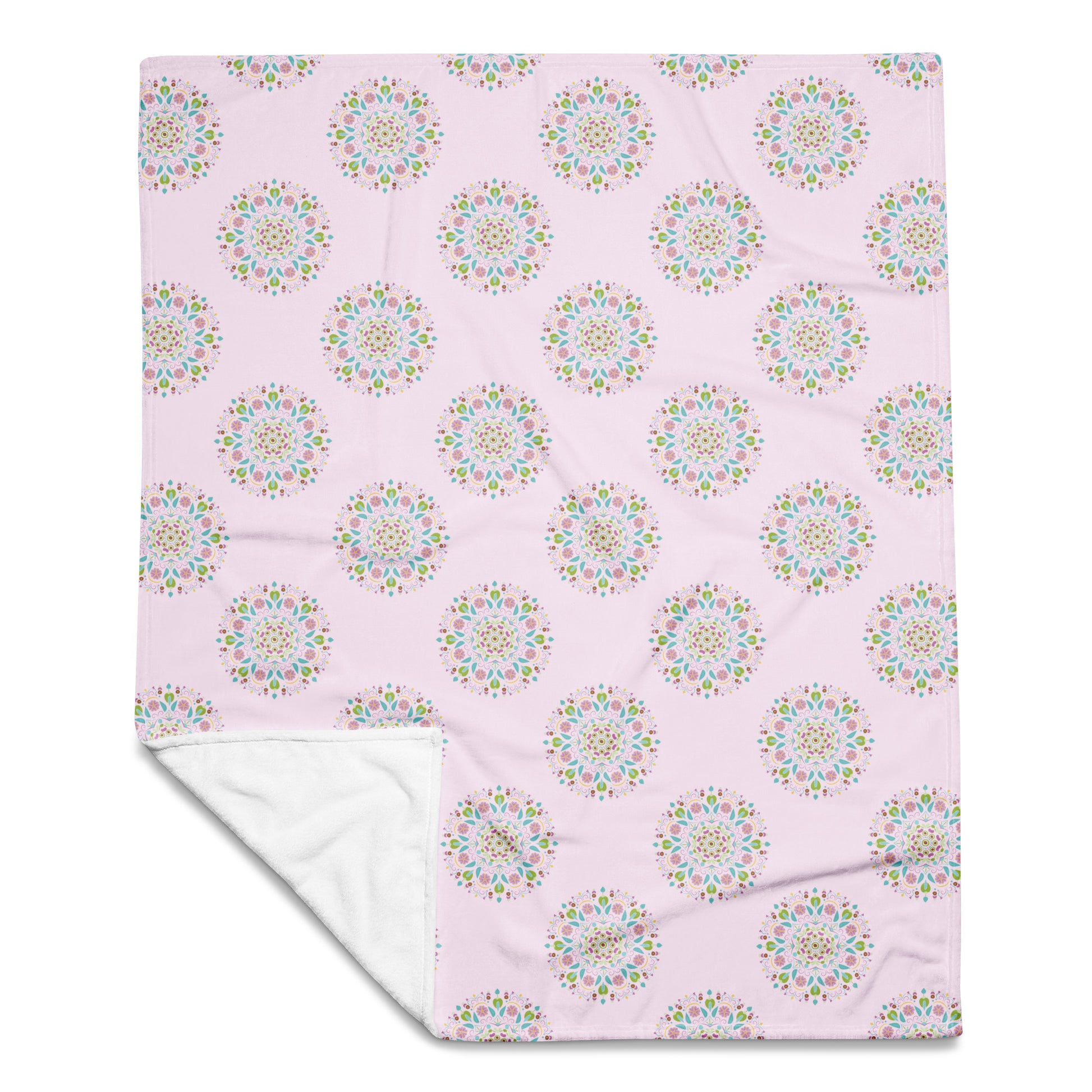 50x60 pink throw blanket with Scandinavian styled mandalas patterned on the front.
