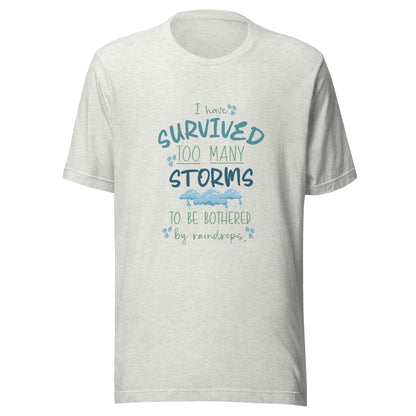 Light gray ash unisex short sleeve t-shirt that states 'I have survived too many storms to be bothered by raindrops' with raindrops and storm clouds.