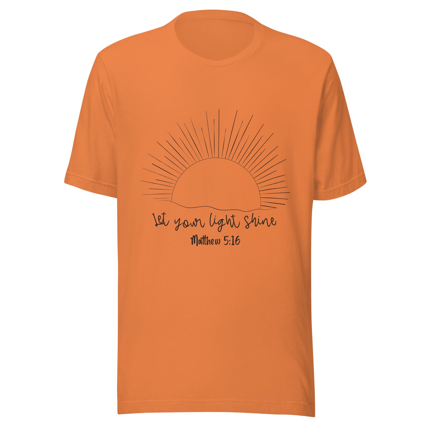 Burnt orange unisex short sleeve t-shirt that has a sun with many rays and underneath says 'Let your light shine', Matthew 5:16.
