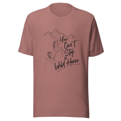 Heather mauve unisex short sleeve t-shirt that states 'You can't stop a wild horse' with a horse rearing up and mountains in the background.