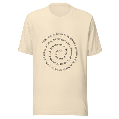 Heather natural unisex short sleeve t-shirt that has a spiral of the words 'God is good all the time all the time God is good', with two small hearts one at the start of the spiral and one at the end in the middle.