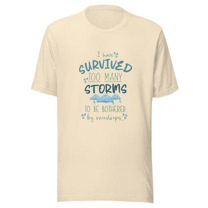 Heather natural unisex short sleeve t-shirt that states 'I have survived too many storms to be bothered by raindrops' with raindrops and storm clouds.