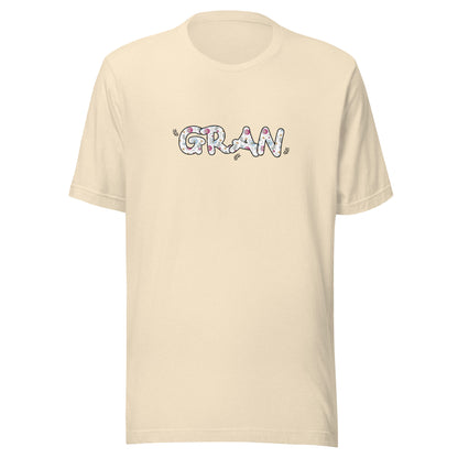 Heather natural short sleeve unisex t-shirt that says Gran on the front written in cute font with flowers inside each letter. 