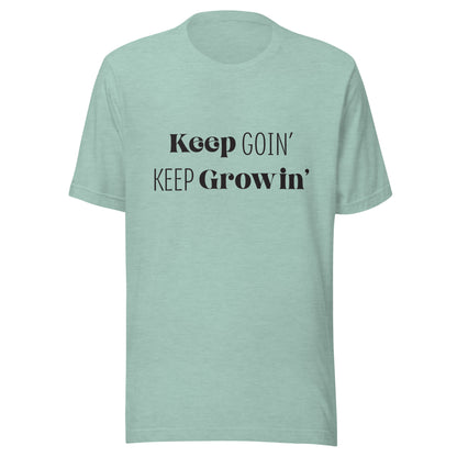 Heather prism dusty blue unisex t-shirt that says 'Keep Goin' Keep Growin'.
