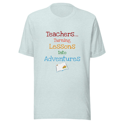 Short sleeve unisex t-shirt that says 'Teachers turning lessons into adventures' with an open book below writing. 