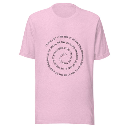 Heather lilac short sleeve t-shirt that has a spiral of the words 'God is good all the time all the time God is good', with two small hearts one at the start of the spiral and one at the end in the middle.