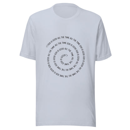 Light blue short sleeve t-shirt that has a spiral of the words 'God is good all the time all the time God is good', with two small hearts one at the start of the spiral and one at the end in the middle.