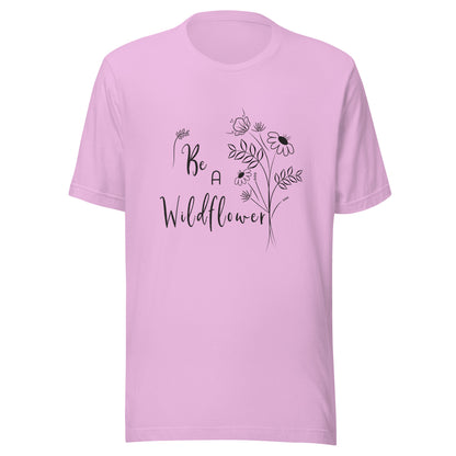 Lilac unisex t-shirt that says 'Be a Wildflower' with wildflowers beside it black ink only.