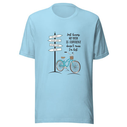 Ocean blue unisex short sleeve t-shirt that says 'Just becaue my path is different doesn't mean I'm lost with a bicycle and street signs that say my way your way either way is ok.