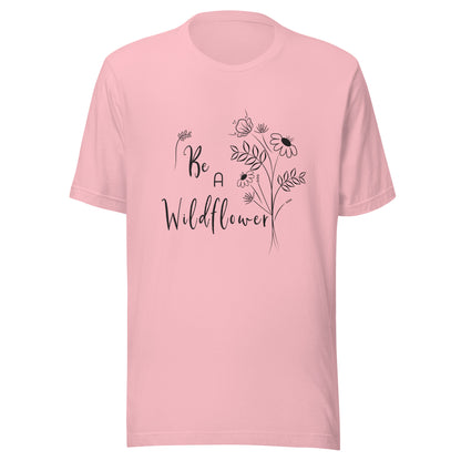 Pink unisex t-shirt that says 'Be a Wildflower' with wildflowers beside it black ink only.