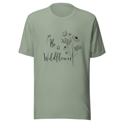 Sage unisex t-shirt that says 'Be a Wildflower' with wildflowers beside it black ink only.