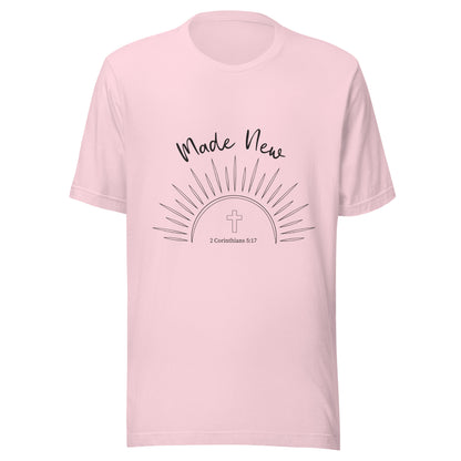 Soft pink short sleeve unisex t-shirt with a Sun and rays below the words 'Made New' and inside the sun is a cross and 2 Corinthians 5:17.