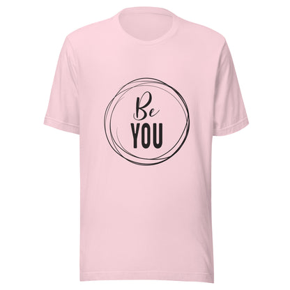 Soft pink unisex short sleeve t-shirt that says 'Be you' inside of a circle.