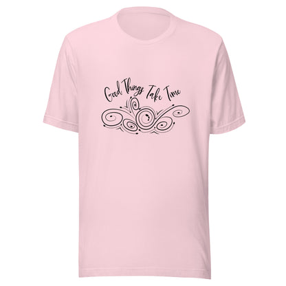 Soft pink unisex short sleeve t-shirt that states 'Good things take time' above a swirly design.