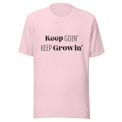 Soft pink unisex t-shirt that says 'Keep Goin' Keep Growin'.