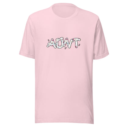 Soft Pink short sleeve unisex t-shirt that says Aunt on the front written in cute font with flowers inside each letter. 