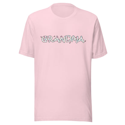 Soft pink short sleeve unisex t-shirt that says Grandma on the front written in cute font with flowers inside each letter. 