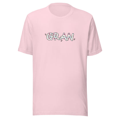 Soft pink short sleeve unisex t-shirt that says Gran on the front written in cute font with flowers inside each letter. 