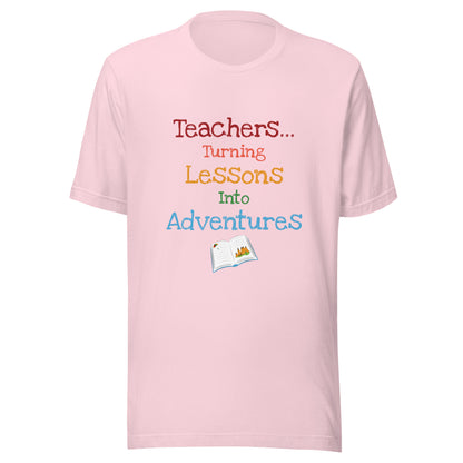 Short sleeve unisex t-shirt that says 'Teachers turning lessons into adventures' with an open book below writing. 