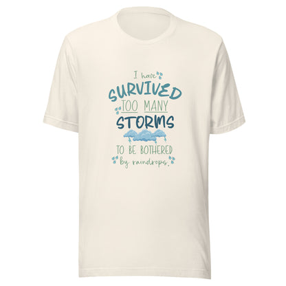 Vintage whiate unisex short sleeve t-shirt that states 'I have survived too many storms to be bothered by raindrops' with raindrops and storm clouds.