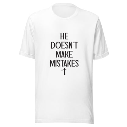 White Unisex short sleeve tee says He Doesn't Make Mistakes with a small cross at the bottom. 