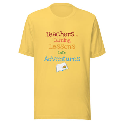 Short sleeve unisex t-shirt that says 'Teachers turning lessons into adventures' with an open book below writing. 