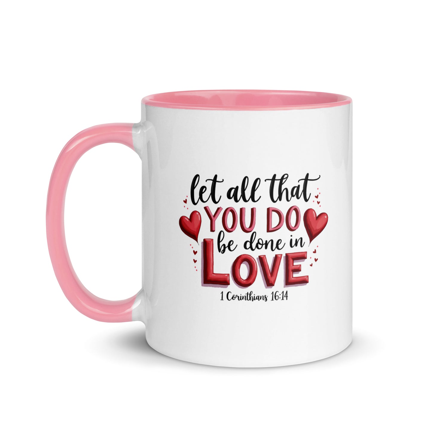 White mug with color handle and interior, featuring a motivational quote that reads Let all You Do be done in Love with hearts.
