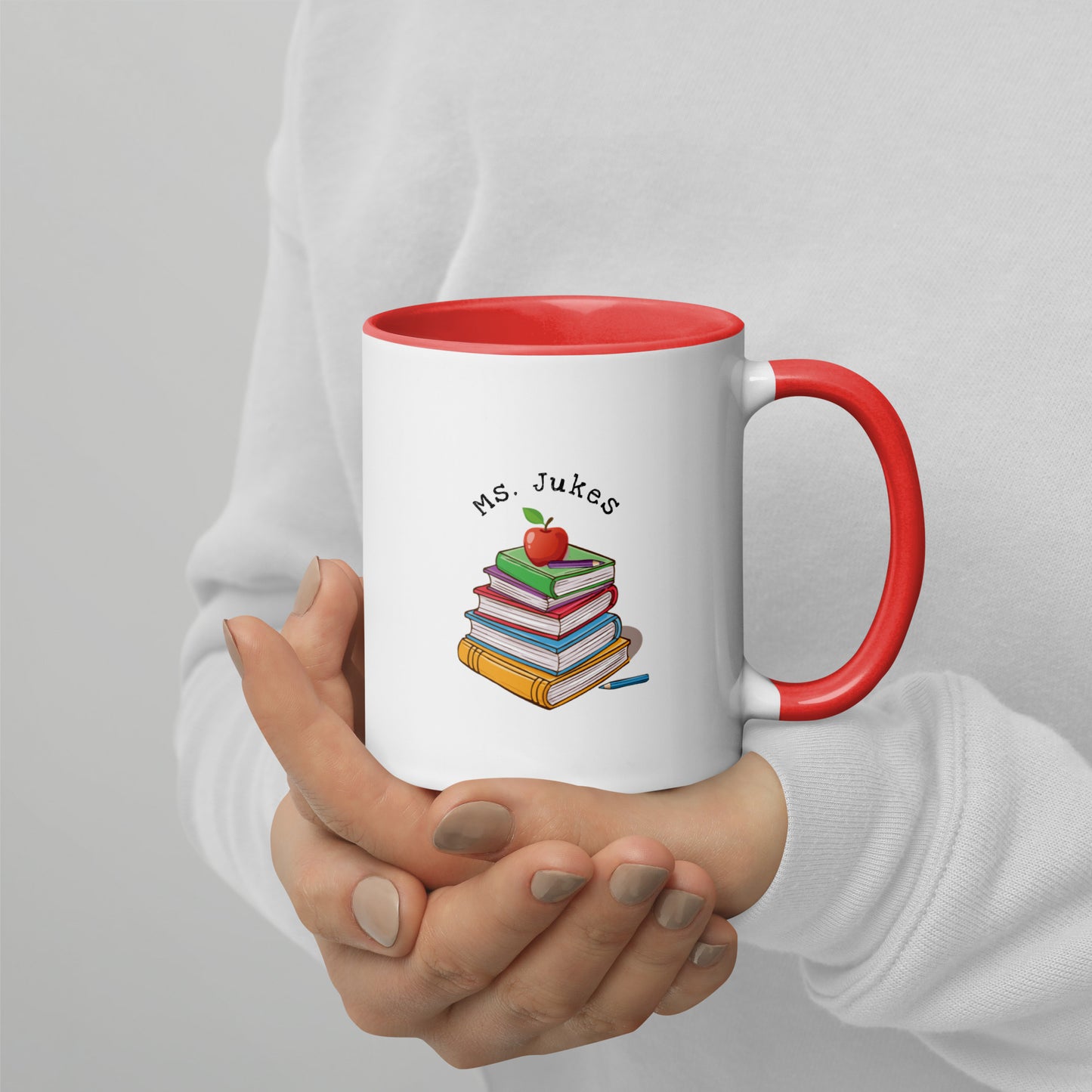 Personalized with Teacher name that says Turning Lessons Into Adventure printed on both sides on white Ceramic Mug with red color handle and inside of mug.