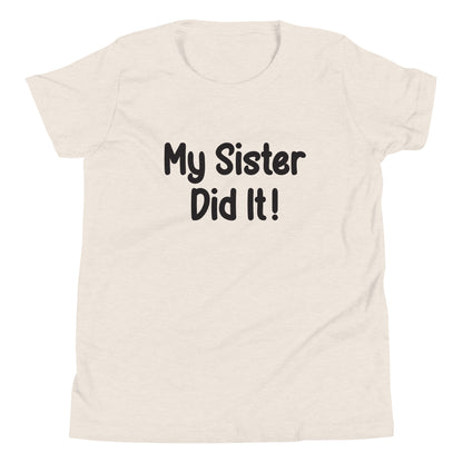 Heather dust short sleeve unisex youth sized t-shirt that says My Sister Did It. 