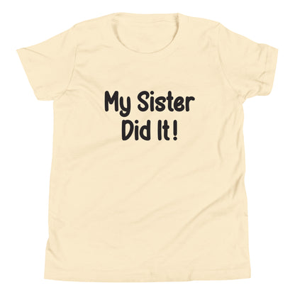 Cream short sleeve unisex youth sized t-shirt that says My Sister Did It. 