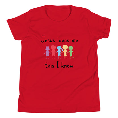 Red short sleeve unisex youth sized t-shirt that says Jesus Loves Me This I Know with 5 children in different cute solid colors holding hands. 